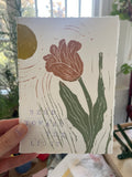 tulip leaning toward a yellow sun