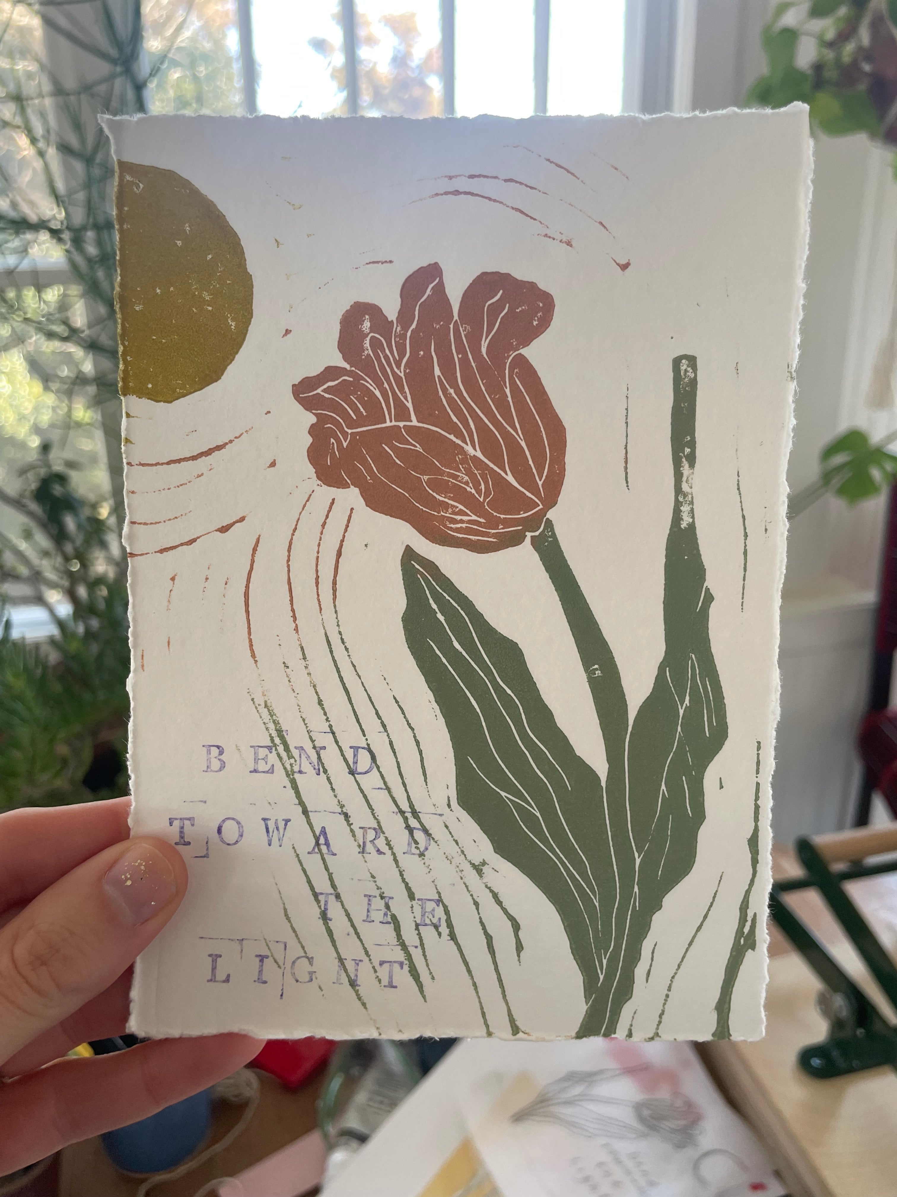 tulip leaning toward a yellow sun