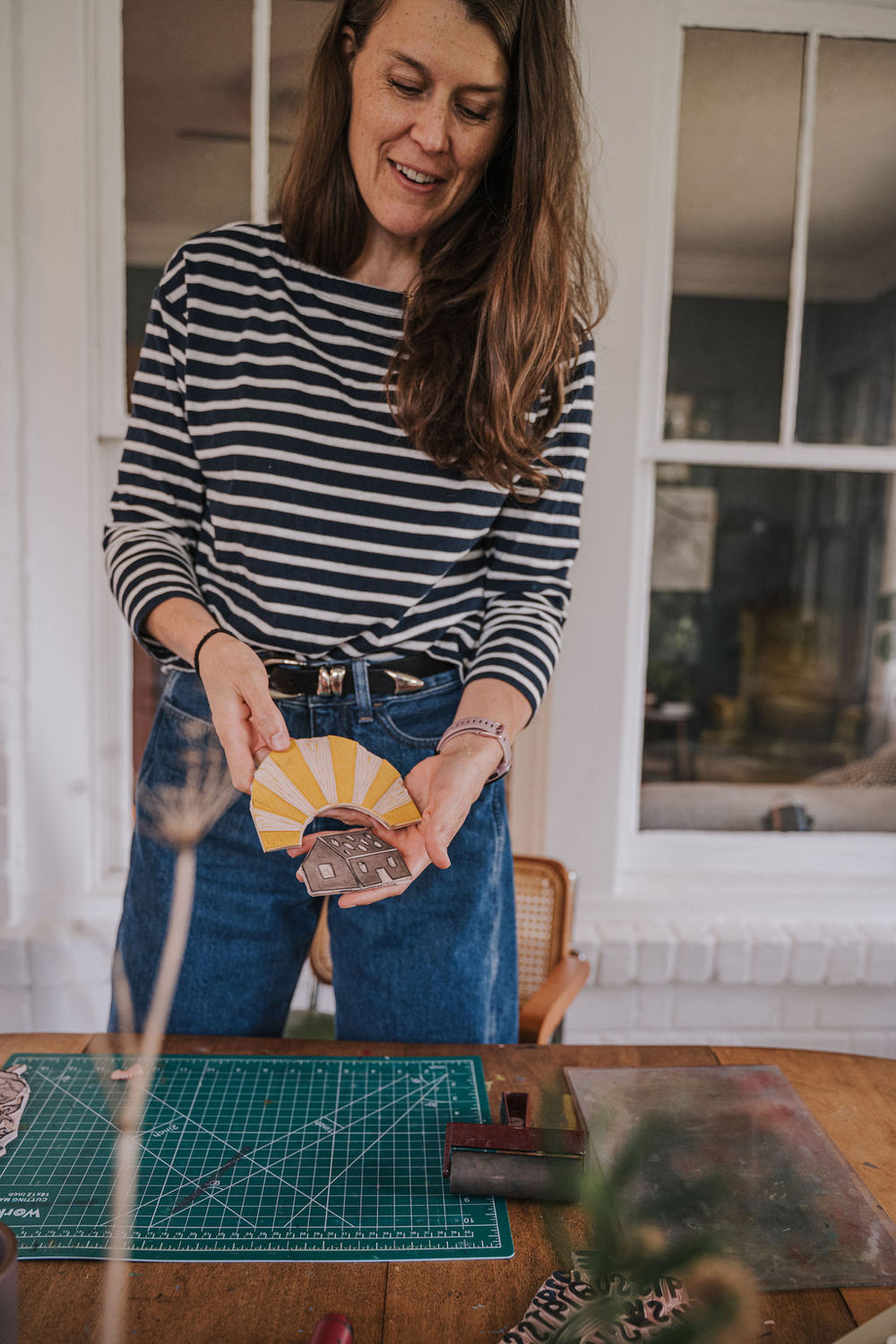 Woman hold linocut blocks
