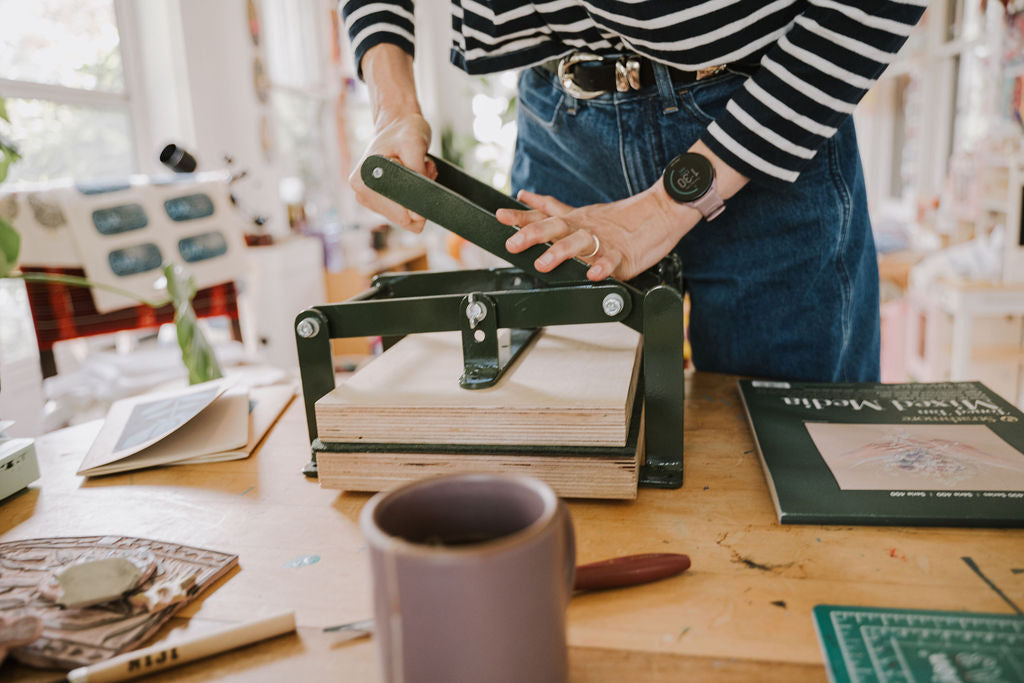 woman using hand press