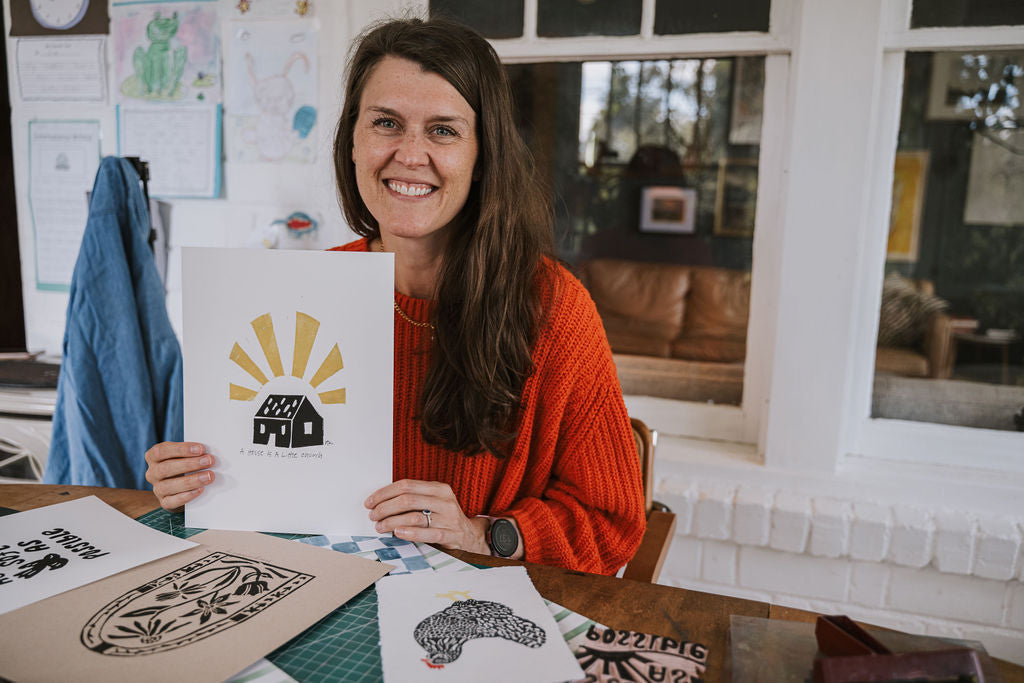 woman holding handmade print