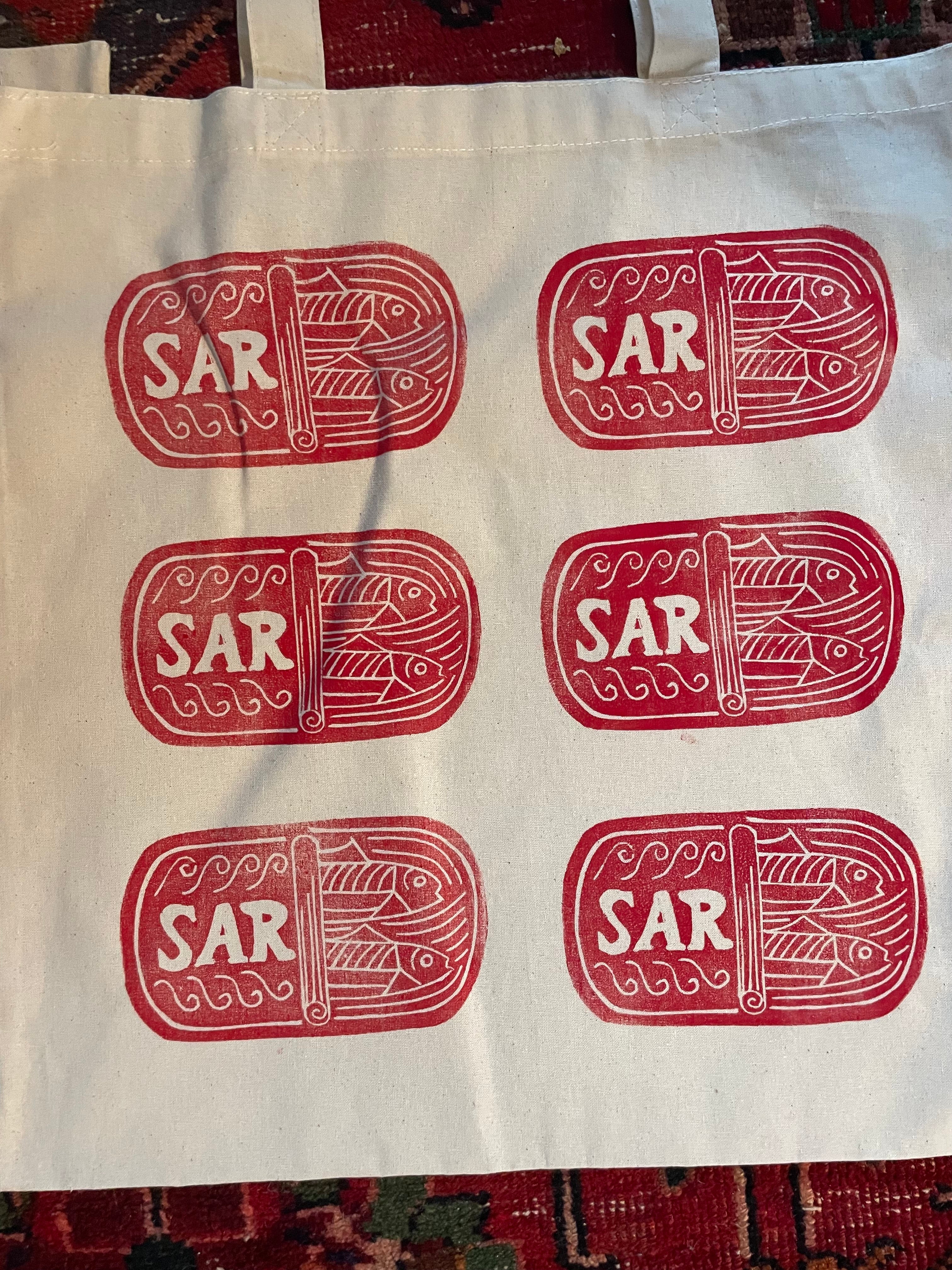 red sardines tin on tote bag